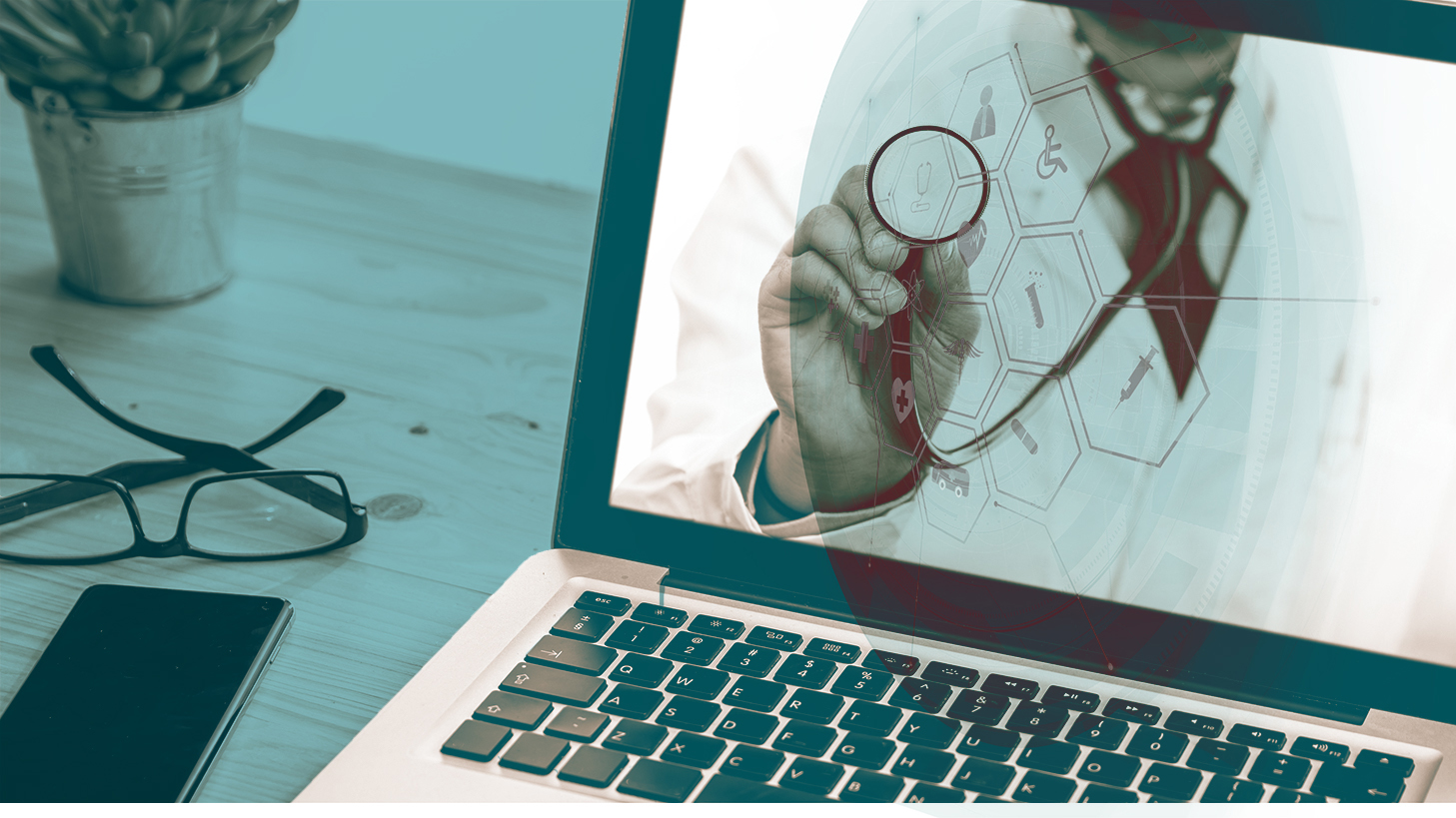 Dr taking pulse of technology via laptop