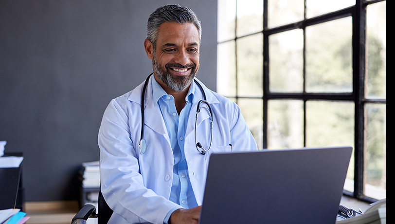 physician on laptop